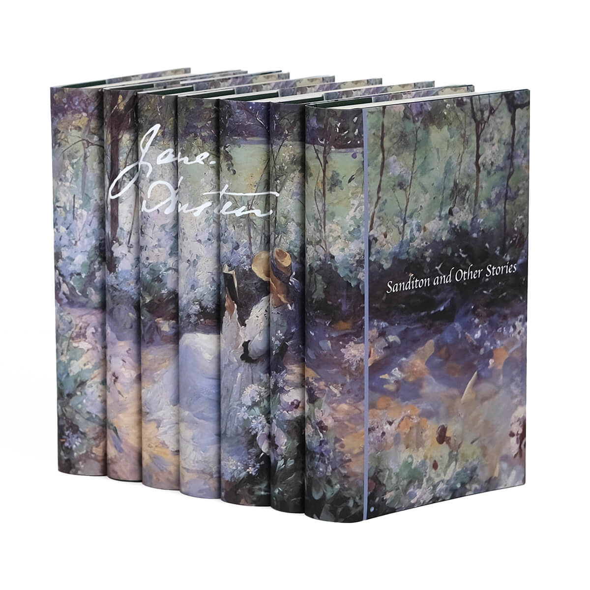 Jane Austen Book Set from Juniper Custom. Dust jackets featuring a Frank Bramley painting of a women reading in a garden across the spines and Jane Austen signature in white.