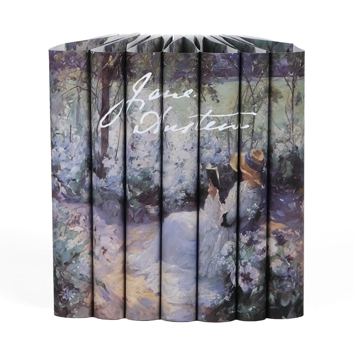 Jane Austen Book Set from Juniper Custom. Dust jackets featuring a Frank Bramley painting of a women reading in a garden across the spines and Jane Austen signature in white.