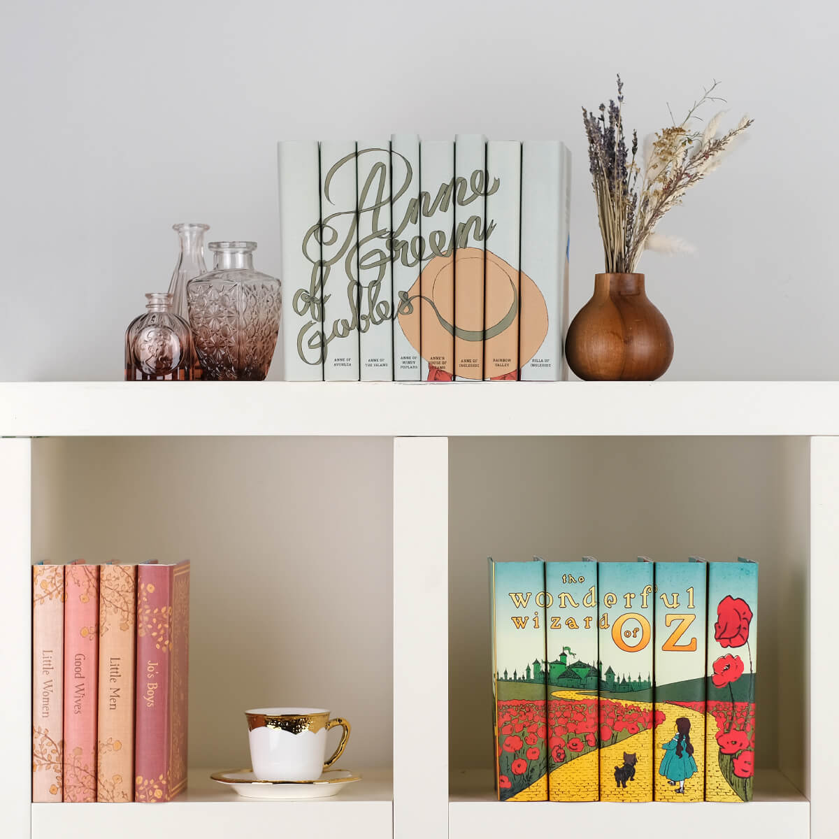 Green book covers featuring a girl in a large hat. Collectible custom dust jackets from Juniper Custom.