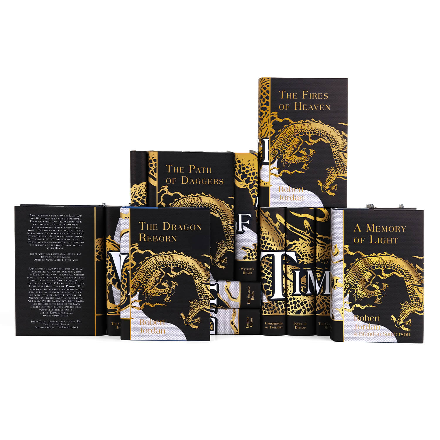 Front view of the covers of The Wheel of Time Book Set by Robert Jordan, from Juniper Books. The covers feature a smaller gold foil dragon going around the edge of the flap and titles and the author’s name in gold foil all set against a black background. Each book cover has a similar style with the same dragon across the front and one book is flipped to show the back cover which features different excerpts from the books.