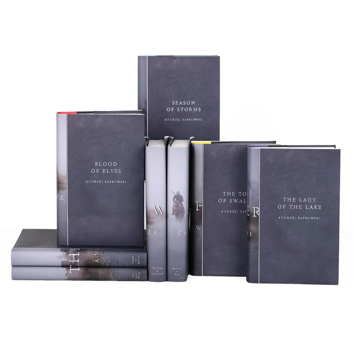 The Witcher custom collectible dust jackets from Juniper Custom. Front covers of dust jackets feature book title and author name in embossed style serif font in grey.