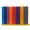 Unjacketed books in the Throne of Glass Series by Sarah J. Maas. Book Spines come in blue, pink, orange, red, purple, yellow, and grey. Title and author name run down spine in silver font, and a tape measure sits against bottom of spines detailing width of complete set.