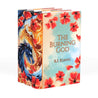 A set of three books from The Poppy War trilogy, displayed at an angle to showcase the cover and spine design. The cover of The Burning God is visible, featuring a serene blue and cream background adorned with vibrant red poppies. The spines align to reveal a dynamic artwork of a blue dragon surrounded by a fiery phoenix and red poppies, creating a cohesive and striking visual.