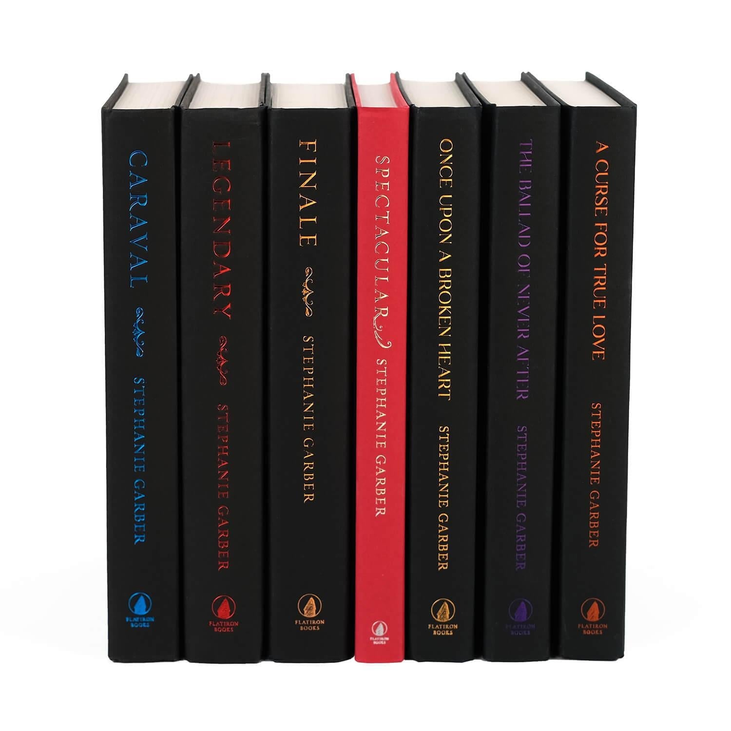 A collection of seven books in the "Caraval" and "Once Upon a Broken Heart" series by Stephanie Garber. The books have black covers with gold accents and feature colorful titles. The titles visible are "Caraval", "Legendary", "Finale", "Spectacular", "Once Upon a Broken Heart", "The Ballad of Never After", and "A Curse for True Love".