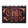 Bronze ornamental gothic illustration of the word "Crave". Illustration set against a pink to black gradients surrounded by embossed style ornaments and a pink heart centered across the spines.