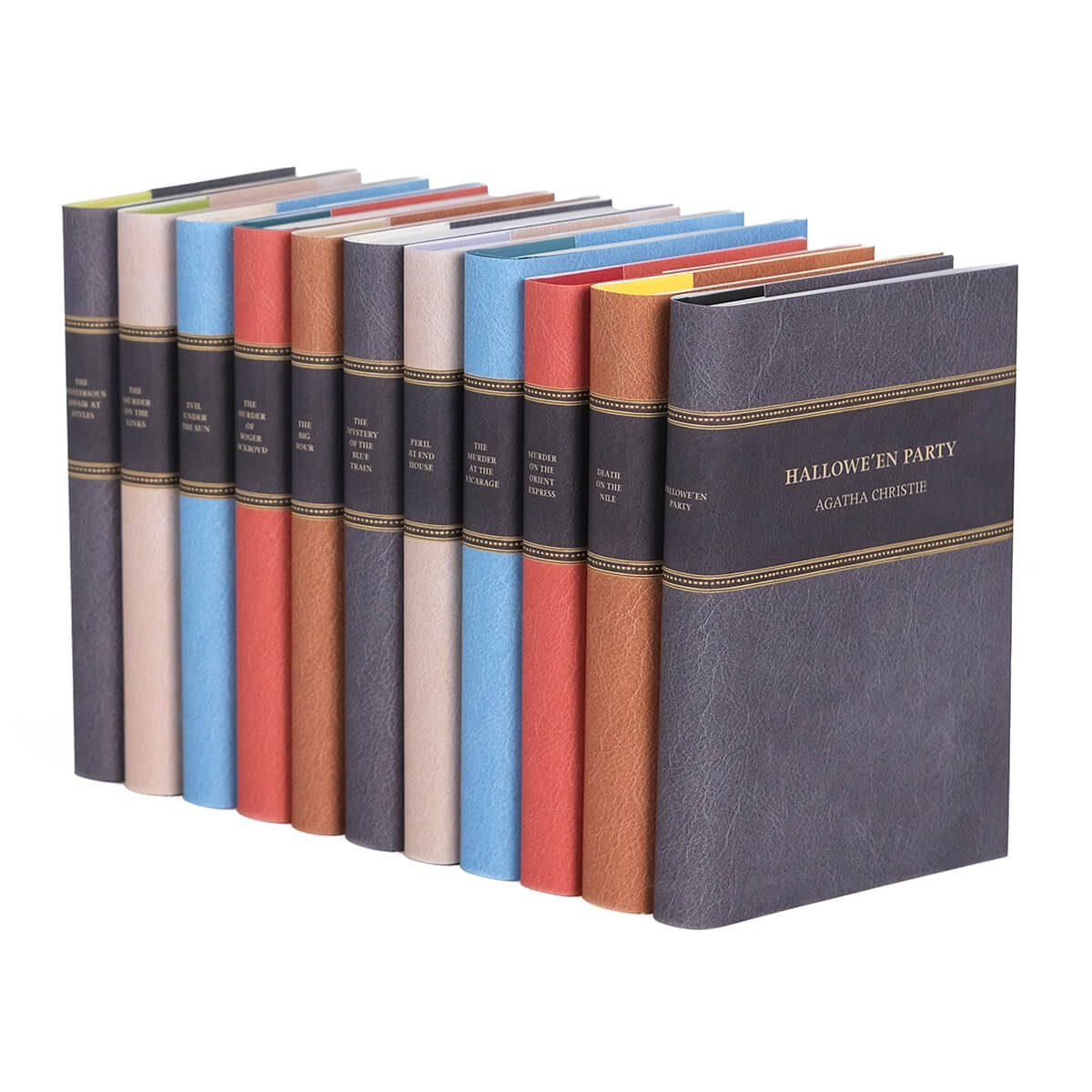 Agatha Christie books wrapped in custom collectible faux leather dust jackets  in black, beige, blue, red, light brown from Juniper Custom. Dust jacket covers feature book title and author name in gold color san serif set against black.