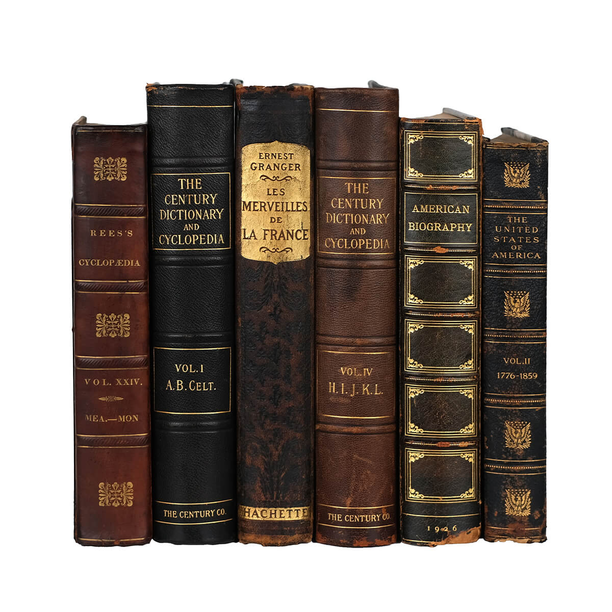 A collection of six vintage leather books from the 1800-1900s shown from the front on a white background. The spines are adorned with gold embellishments and refined gold typography. The titles on the spines showcase titles in French and English, and explore a variety of topics in the arts and humanities. The books are bound in varied shades of brown and black leather.