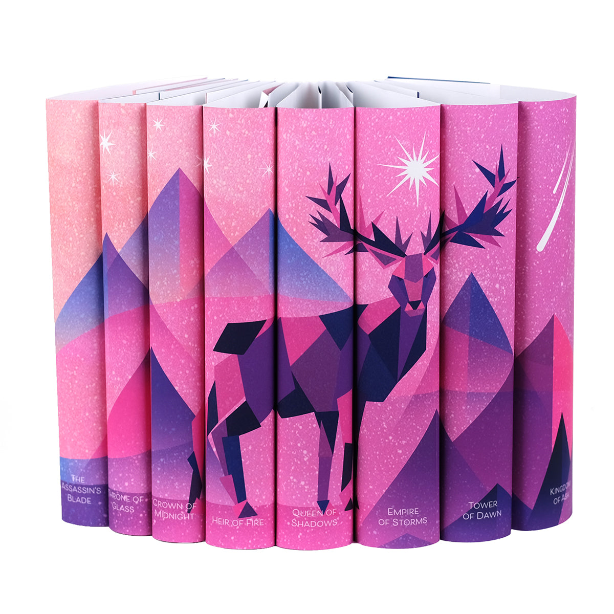 Dust jackets for Throne of Glass Series feature a illustrated stag in shades of pink and purple set against a pink and purple background. Mountains sit behind the stag mixed with a white starry background.