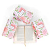 Open book view of The Handmaid's Tale, surrounded by other books in the Influential Women Book Set from Juniper Custom. Open book displays the print size. The covers feature a watercolor rose floral design and the titles on the cover in a white box with burgundy trim.