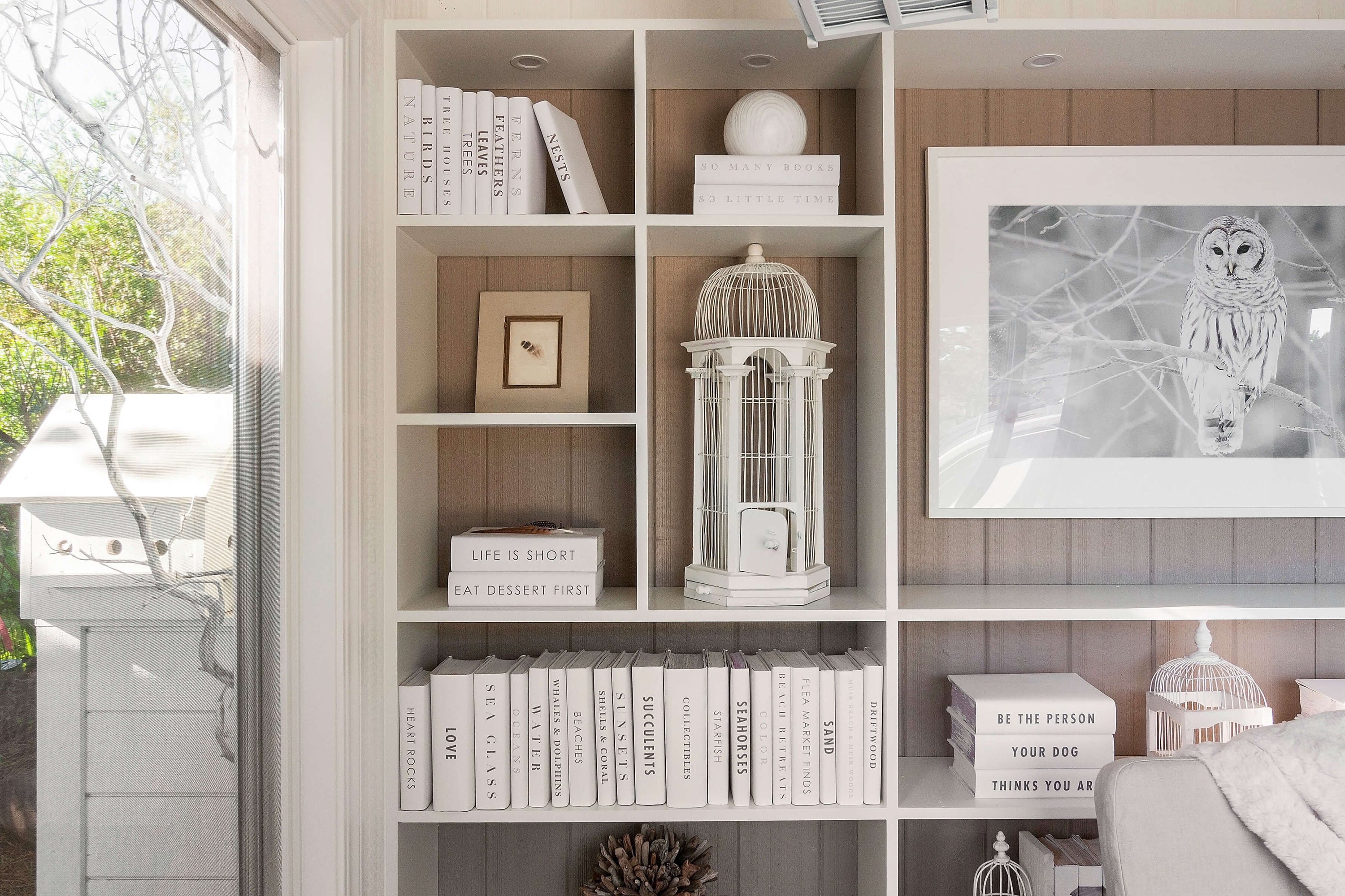 Some of our beachside projects are shown here, but the possibilities are endless. We have frequently taken a minimalistic approach to beach house book collections by crafting a series of pristine white book jackets