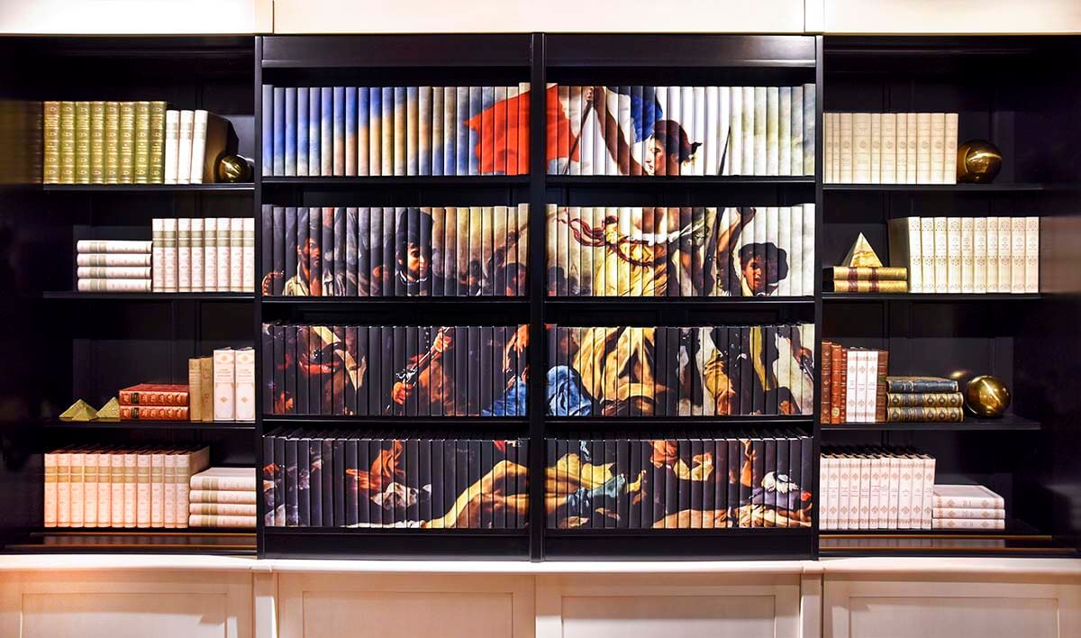 Elevate your space with a stunning Decorative Book Mural Art Installation by Juniper Custom. Whether you're looking to install a one-of-a-kind work of art unlike anything guests have seen before, captivate event attendees, or show off your brand in a creative way,  our customizable installations offer endless possibilities. 