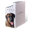 Angled view of custom Family Pet Book Set with visible book jacket spine and cover design by Juniper Custom.