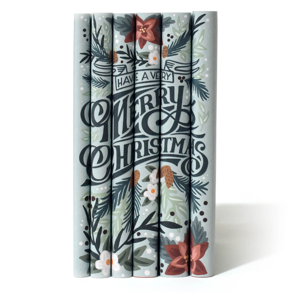 This festive set of novels is the perfect way to celebrate your favorite year-end traditions. Book Set, gift, trade, Christmas shopping. Merry Christmas written across spines featuring illustrated pine bows and pine cones.