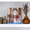 Major Works of Philopsophy Book Set from Juniper Books sitting on a white bookshelf. Then book set is surrounded by dried flowers in a wooden vase, and grey pottery.