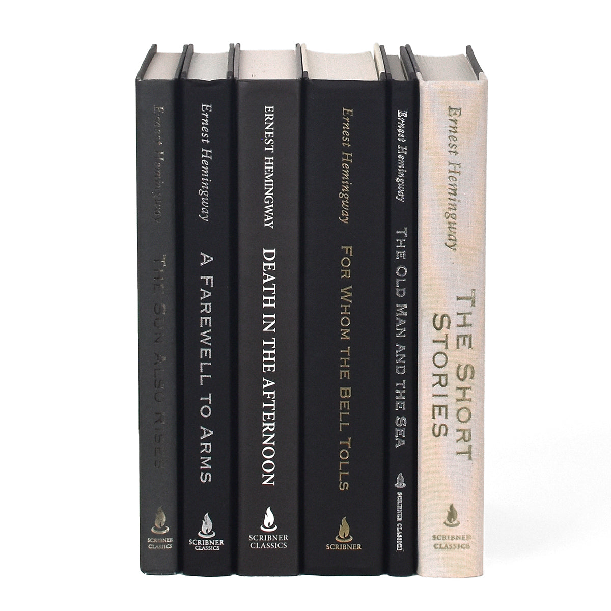 Unjacketed spines in the Ernest Hemingway Elephant Set. Spines include author name, book title, and publisher.