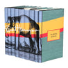 A set of eight blue hardcover books by Ernest Hemingway arranged side by side to form a continuous cover illustration set at an angle. The cover features an elephant standing against a background with horizontal yellow and red stripes, with Ernest Hemingway's signature in white spanning across the spines. Each spine displays the title of a book. Front covers have title of book in yellow box outlined in red.