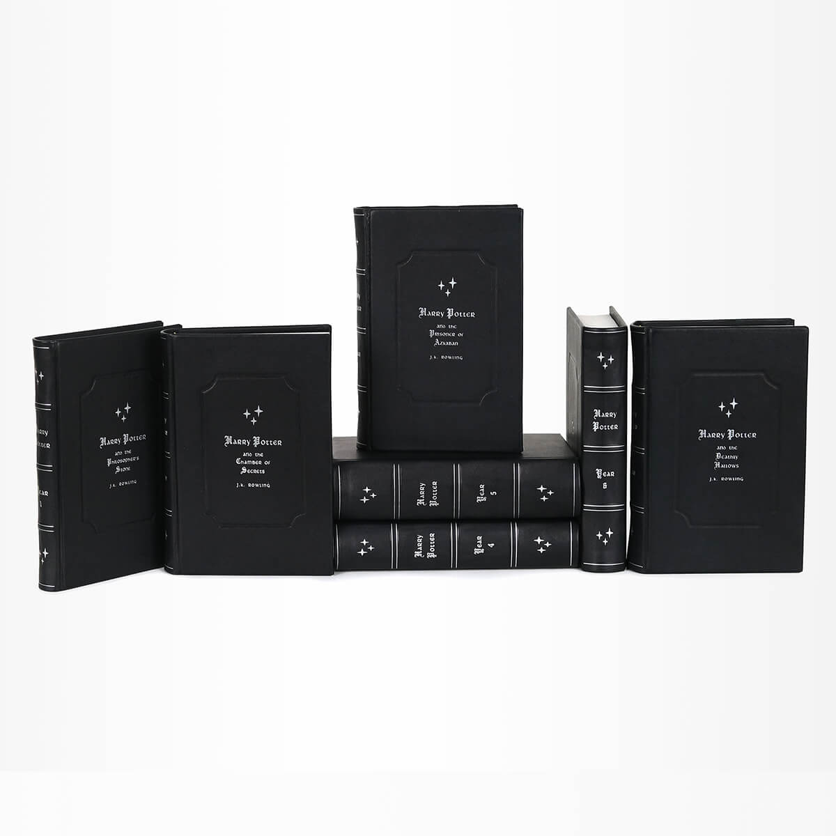 Genuine black leather Harry Potter from Juniper Books with silver book titles, silver ornaments, and silver stars on spines. Front cover features book titles and author name in silver gothic font.