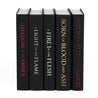 Unjacketed book spines in The Flesh and Fire Series from Juniper Book. Black spines feature book title in foil.