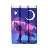 Front shot of spines in The Crescent City Book Set from Juniper Books. Covers eaturing pink and purple hues, a howling wolf set against mountains, and a starry sky. Star and crescent moon above wolf.