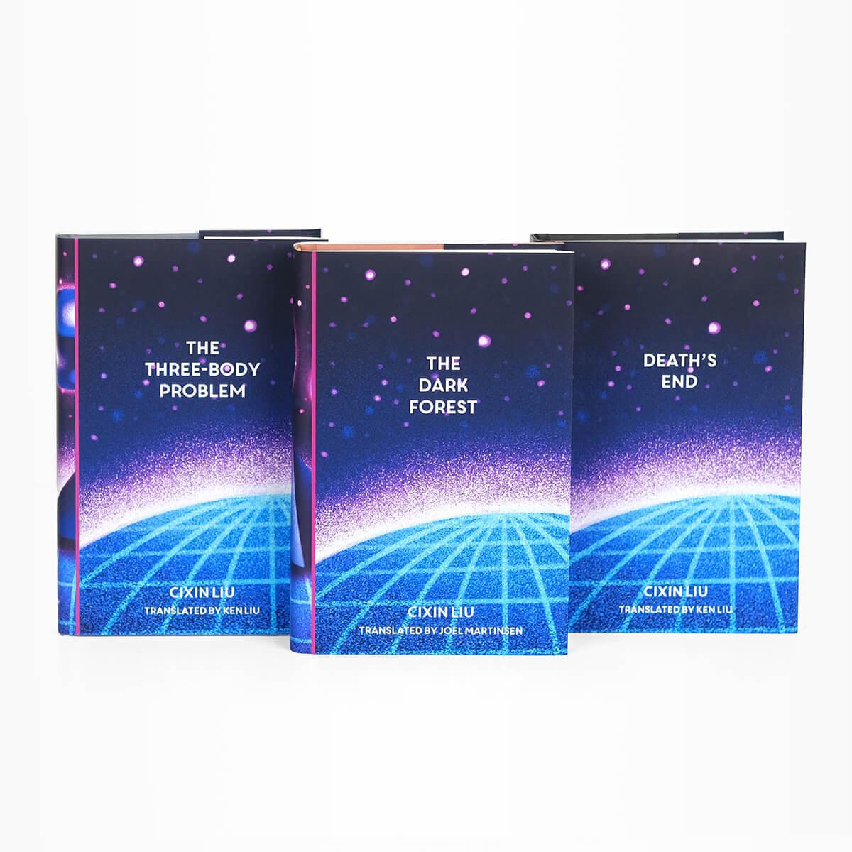 Dust jacket covers features pink texture and particles floating on blue background with a edge of a blue circle with longitude latitude lines running across it. Book title and author typed across cover in bold white serif type.